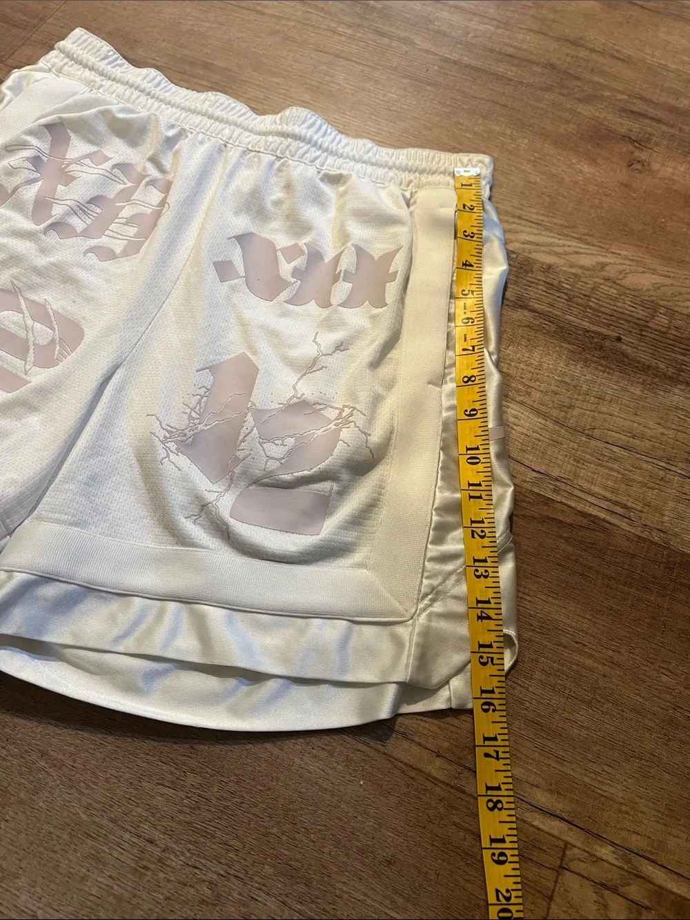 Nike Men’s White Athletic Shorts with Pale Pink Graphic